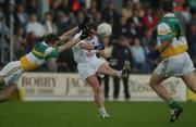 22 June 2002; Eddie McCormack of Kildare in action against Karol Slattery of Offaly during the Bank of Ireland Leinster Senior Football Championship Semi-Final Replay match between Kildare and Offaly at Nowlan Park in Kilkenny. Photo by Brendan Moran/Sportsfile