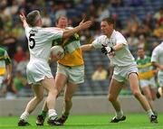 23 June 2002; Ross Evans of Offaly in action against Kildare's Sean Moriarty, left, and Brian Gavin during the Bank of Ireland Leinster Junior Football Championship Semi-Final match between Offaly and Kildare at Croke Park in Dublin. Photo by Brian Lawless/Sportsfile