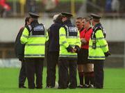 22 June 2002; Referee Paddy Russell is surrounded by stewards and members of the Garda’ prior to the start of extra-time during the Bank of Ireland Leinster Senior Football Championship Semi-Final Replay match between Kildare and Offaly at Nowlan Park in Kilkenny. Photo by Damien Eagers/Sportsfile
