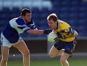 22 June 2002; Michael O'Shea of Clare is tackled by Derek Conroy of Laois during the Bank of Ireland All-Ireland Senior Football Championship Qualifying Round 2 match between Laois and Clare at O'Moore Park in Portlaoise, Laois. Photo by Aoife Rice/Sportsfile