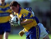 22 June 2002; Denis O'Driscoll of Clare is tackled by Laois's Joe Higgins during the Bank of Ireland All-Ireland Senior Football Championship Qualifying Round 2 match between Laois and Clare at O'Moore Park in Portlaoise, Laois. Photo by Aoife Rice/Sportsfile