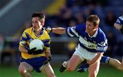22 June 2002; Michael O'Dwyer of Clare is tackled by David Brennan of Laois during the Bank of Ireland All-Ireland Senior Football Championship Qualifying Round 2 match between Laois and Clare at O'Moore Park in Portlaoise, Laois. Photo by Aoife Rice/Sportsfile