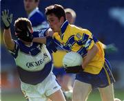 22 June 2002; Michael O'Dwyer of Clare in action against Laois's Damien Ryan during the Bank of Ireland All-Ireland Senior Football Championship Qualifying Round 2 match between Laois and Clare at O'Moore Park in Portlaoise, Laois. Photo by Aoife Rice/Sportsfile