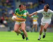 23 June 2002; Tom Crampton of Offaly in action against Pauric Kelly of Kildare during the Bank of Ireland Leinster Junior Football Championship Semi-Final match between Offaly and Kildare at Croke Park in Dublin. Photo by Ray McManus/Sportsfile