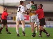 22 June 2002; Linesman Michael Walsh seperates Offaly's Finbar Cullen and Kildare's Derek McCormack during the Bank of Ireland Leinster Senior Football Championship Semi-Final Replay match between Kildare and Offaly at Nowlan Park in Kilkenny. Photo by Brendan Moran/Sportsfile