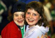23 June 2002; Special Olympian Aoife O'Sullivan and her sister Ciara, from Cork city, during the 2002 Special Olympics Ireland National Games closing ceremony at the RDS in Dublin. Photo by Ray McManus/Sportsfile