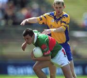 23 June 2002; Trevor Mortimer of Mayo in action against Gary Cox of Roscommon during the Bank of Ireland All-Ireland Senior Football Championship Qualifier Round 2 between Mayo and Roscommon at MacHale Park in Castlebar, Mayo. Photo by David Maher/Sportsfile