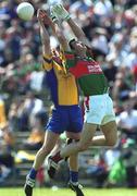 23 June 2002; Seamus O'Neill of Roscommon in action against Shane Trench of Mayo during the Bank of Ireland All-Ireland Senior Football Championship Qualifier Round 2 between Mayo and Roscommon at MacHale Park in Castlebar, Mayo. Photo by David Maher/Sportsfile