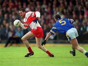 23 June 2002; Gavin Diamond of Derry in action against Ciaran Keogh of Longford during the Bank of Ireland All-Ireland Senior Football Championship Qualifier Round 2 match between Longford and Derry at Pearse Park in Longford. Photo by Aoife Rice/Sportsfile