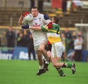22 June 2002; Ronan Sweeney of Kildare in action against Cathal Daly of Offaly during the Bank of Ireland Leinster Senior Football Championship Semi-Final Replay match between Kildare and Offaly at Nowlan Park in Kilkenny. Photo by Brendan Moran/Sportsfile