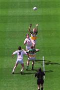 23 June 2002; Gordon Nutterfield of Offaly and Kildare's Eric Dockery challenge for the ball, following the throw-in from referee David Coldrick, at the start of the Bank of Ireland Leinster Junior Football Championship Semi-Final match between Offaly and Kildare at Croke Park in Dublin. Photo by Brian Lawless/Sportsfile