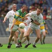23 June 2002; Ross Evans of Offaly in action against Kildare's Sean Moriarty, left, and Brian Graven during the Bank of Ireland Leinster Junior Football Championship Semi-Final match between Offaly and Kildare at Croke Park in Dublin. Photo by Brian Lawless/Sportsfile