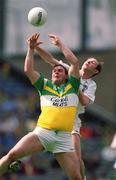 23 June 2002; Tom Crampton of Offaly in action against Pauric Kelly of Kildare during the Bank of Ireland Leinster Junior Football Championship Semi-Final match between Offaly and Kildare at Croke Park in Dublin. Photo by Damien Eagers/Sportsfile