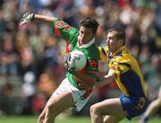 23 June 2002; James Gill of Mayo in action against Gary Cox of Roscommon during the Bank of Ireland All-Ireland Senior Football Championship Qualifier Round 2 between Mayo and Roscommon at MacHale Park in Castlebar, Mayo. Photo by David Maher/Sportsfile