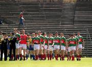 23 June 2002; The Mayo and Roscommon teams parade in front of an empty terrace prior to the Bank of Ireland All-Ireland Senior Football Championship Qualifier Round 2 between Mayo and Roscommon at MacHale Park in Castlebar, Mayo. Photo by David Maher/Sportsfile