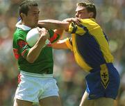 23 June 2002; Trevor Mortimer of Mayo in action against Paul Noonn of Roscommon during the Bank of Ireland All-Ireland Senior Football Championship Qualifier Round 2 between Mayo and Roscommon at MacHale Park in Castlebar, Mayo. Photo by David Maher/Sportsfile