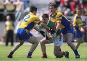 23 June 2002; Brian Maloney of Mayo in action against John Hanley, left and David Casey of Roscommon during the Bank of Ireland All-Ireland Senior Football Championship Qualifier Round 2 between Mayo and Roscommon at MacHale Park in Castlebar, Mayo. Photo by David Maher/Sportsfile