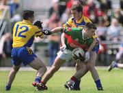 23 June 2002; Brian Maloney of Mayo in action against John Hanley, left, and David Casey of Roscommon during the Bank of Ireland All-Ireland Senior Football Championship Qualifier Round 2 between Mayo and Roscommon at MacHale Park in Castlebar, Mayo. Photo by David Maher/Sportsfile