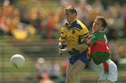 23 June 2002; Jonathan Dunning of Roscommon in action against Mayo's Ray Connell during the Bank of Ireland All-Ireland Senior Football Championship Qualifier Round 2 between Mayo and Roscommon at MacHale Park in Castlebar, Mayo. Photo by David Maher/Sportsfile