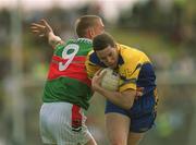 23 June 2002; Stephen Lohan of Roscommon in action against David Heaney of Mayo during the Bank of Ireland All-Ireland Senior Football Championship Qualifier Round 2 between Mayo and Roscommon at MacHale Park in Castlebar, Mayo. Photo by David Maher/Sportsfile