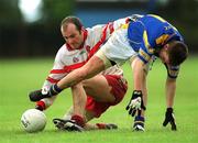23 June 2002; Fergal Crossan of Derry in action against Longford's Ronan Clyne during the Bank of Ireland All-Ireland Senior Football Championship Qualifier Round 2 match between Longford and Derry at Pearse Park in Longford. Photo by Aoife Rice/Sportsfile