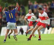 23 June 2002; Enda Muldoon of Derry in action against Longford's David Blessington during the Bank of Ireland All-Ireland Senior Football Championship Qualifier Round 2 match between Longford and Derry at Pearse Park in Longford. Photo by Aoife Rice/Sportsfile