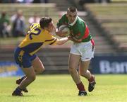 23 June 2002; Alan Roche of Mayo in action against John Hanley of Roscommon during the Bank of Ireland All-Ireland Senior Football Championship Qualifier Round 2 between Mayo and Roscommon at MacHale Park in Castlebar, Mayo. Photo by David Maher/Sportsfile