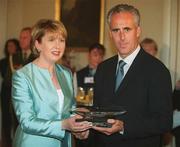 18 June 2002; Her Excellencey, President Mary McAleese, presents Republic of Ireland manager Mick McCarthy with a Waterford Crystal plate during a reception at çras an Uachtaráin prior to the Republic of Ireland homecoming in Phoenix Park, Dublin, following the 2002 FIFA World Cup Finals in South Korea and Japan. Photo by Pat Murphy/Sportsfile