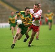16 June 2002; Adrian Sweeney of Donegal, in action against Niall McCuskar of Derry during the Bank of Ireland Ulster Senior Football Championship Semi-Final match between Donegal and Derry at St TiernachÕs Park in Clones, Monaghan. Photo by Aoife Rice/Sportsfile