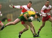 16 June 2002; Adrian Sweeney of Donegal, in action against Niall McCuskar of Derry during the  Bank of Ireland Ulster Senior Football Championship Semi-Final match between Donegal and Derry at St TiernachÕs Park in Clones, Monaghan. Photo by Aoife Rice/Sportsfile