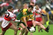 16 June 2002; Christy Toye of Donegal in action against Derry's Brian Mullan, left, and Niall McCuskar during the Bank of Ireland Ulster Senior Football Championship Semi-Final match between Donegal and Derry at St TiernachÕs Park in Clones, Monaghan. Photo by Aoife Rice/Sportsfile