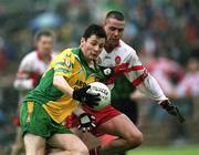 16 June 2002; Christy Toye of Donegal in action against Ciaran McNally of Derry during the Bank of Ireland Ulster Senior Football Championship Semi-Final match between Donegal and Derry at St TiernachÕs Park in Clones, Monaghan. Photo by Aoife Rice/Sportsfile