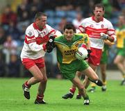 16 June 2002; Christy Toye of Donegal in action against Ciaran McNally of Derry during the Bank of Ireland Ulster Senior Football Championship Semi-Final match between Donegal and Derry at St TiernachÕs Park in Clones, Monaghan. Photo by Damien Eagers/Sportsfile