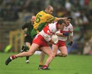 16 June 2002; Anthony Tohill of Derry in action against Paul McGonigle of Donegal during the Bank of Ireland Ulster Senior Football Championship Semi-Final match between Donegal and Derry at St TiernachÕs Park in Clones, Monaghan. Photo by Damien Eagers/Sportsfile