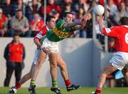 23 June 2002; Eoin Brosnan of Kerry is tackled by Martin Cronin of Cork during the Bank of Ireland Munster Senior Football Championship Semi-Final Replay match between Cork and Kerry at Páirc U’ Chaoimh in Cork. Photo by Brendan Moran/Sportsfile