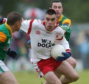 29 June 2002; Ryan McMenamin of Tyrone in action against Leitrim's Terry Kelleher, left, and Fintan McBrien during the Bank of Ireland All-Ireland Senior Football Championship Qualifying Round 2 match between Tyrone and Leitrim at Páirc Seán Mac Diarmada in Carrick-on-Shannon, Leitrim. Photo by Aoife Rice/Sportsfile