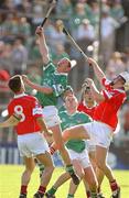 29 June 2002; Ciaran Carey of Limerick contests a high ball with Cork's Timmy McCarthy during the Guinness All-Ireland Senior Hurling Championship Qualifying Round 1 match between Cork and Limerick at Semple Stadium in Thurles, Tipperary. Photo by Brendan Moran/Sportsfile