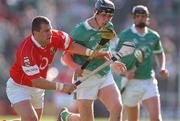 29 June 2002; Mark Keane of Limerick in action against Cork's Diarmuid O'Sullivan during the Guinness All-Ireland Senior Hurling Championship Qualifying Round 1 match between Cork and Limerick at Semple Stadium in Thurles, Tipperary. Photo by Brendan Moran/Sportsfile