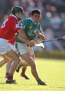 29 June 2002; Peter Lawlor of Limerick in action against Cork's Jerry O'Connor during the Guinness All-Ireland Senior Hurling Championship Qualifying Round 1 match between Cork and Limerick at Semple Stadium in Thurles, Tipperary. Photo by Brendan Moran/Sportsfile