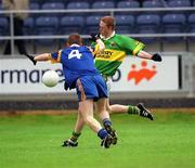 30 June 2002; Colm Cooper of Kerry is tackled by Wicklow's Thomas Burke during the Bank of Ireland All-Ireland Senior Football Championship Qualifying Round 2 match between Kerry and Wicklow at O'Moore Park in Portlaoise, Laois. Photo by Aoife Rice/Sportsfile