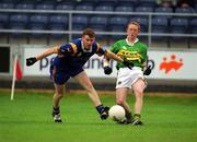 30 June 2002; Colm Cooper of Kerry is tackled by Wicklow's Thomas Burke during the Bank of Ireland All-Ireland Senior Football Championship Qualifying Round 2 match between Kerry and Wicklow at O'Moore Park in Portlaoise, Laois. Photo by Aoife Rice/Sportsfile