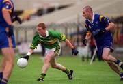 30 June 2002; Colm Cooper of Kerryin action against Wicklow's Brendan Daly during the Bank of Ireland All-Ireland Senior Football Championship Qualifying Round 2 match between Kerry and Wicklow at O'Moore Park in Portlaoise, Laois. Photo by Aoife Rice/Sportsfile