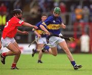 30 June 2002; Tony Scroope of Tipperary in action against Richard Relihan of Cork during the Munster Minor Hurling Championship Final match between Cork and Tipperary at Páirc U’ Chaoimh in Cork. Photo by Brendan Moran/Sportsfile