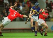 30 June 2002; Trevor Ivors of Tipperary in action against Brian Lane, left, and David Murphy of Cork during the Munster Minor Hurling Championship Final match between Cork and Tipperary at Páirc U’ Chaoimh in Cork. Photo by Brendan Moran/Sportsfile