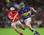 30 June 2002; Tony Scroope of Tipperary in action against Kevin Hartnett of Cork during the Munster Minor Hurling Championship Final match between Cork and Tipperary at Páirc U’ Chaoimh in Cork. Photo by Brendan Moran/Sportsfile