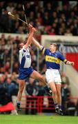 30 June 2002; Brian O'Meara of Tipperary in action against Waterford's Peter Queally during the Guinness Munster Senior Hurling Championship Final match between Waterford and Tipperary at Páirc Uí Chaoimh in Cork. Photo by Brendan Moran/Sportsfile