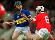 30 June 2002; Francis Devaney of Tipperary in action against Kevin Hartnett of Cork during the Munster Minor Hurling Championship Final match between Cork and Tipperary at Páirc U’ Chaoimh in Cork. Photo by Ray McManus/Sportsfile