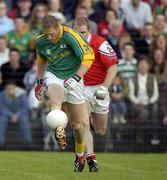 29 June 2002; Graham Geraghty of Meath in action against Aaron Hoey of Louth during the Bank of Ireland All-Ireland Senior Football Championship Qualifying Round 2 match between Meath and Louth at Páirc Tailteann in Navan, Meath. Photo by Damien Eagers/Sportsfile