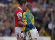29 June 2002; Graham Geraghty of Meath, clashes with Seamus O'Hanlon of Louth off the ball during the Bank of Ireland All-Ireland Senior Football Championship Qualifying Round 2 match between Meath and Louth at Páirc Tailteann in Navan, Meath. Photo by Damien Eagers/Sportsfile