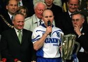 30 June 2002; Waterford captain Fergal Hartley makes his speech in the company of Christy Cooney, Chairman of the Munster Council, right, and Michael Whelan of Guinness following the Guinness Munster Senior Hurling Championship Final match between Waterford and Tipperary at Páirc Uí Chaoimh in Cork. Photo by Brendan Moran/Sportsfile